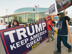 REPUBLICANOS. Simpatizantes del presidente Donald Trump irrumpen en el ambiente electoral demócrata en Nueva Hampshire. AFP