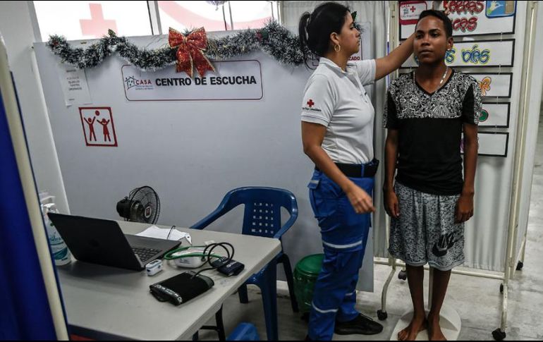 La llegada de miles de venezolanos ha mejorado la vida de miles de colombianos que se han beneficiado indirectamente de la ayuda humanitaria. AFP