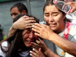 Mujer alcanzada por gas pimienta arrojado por la policía antidisturbios. La ONU recomendó desarrollar nuevos protocolos policiales para garantizar el uso adecuado de la fuerza. EFE/S. Silva
