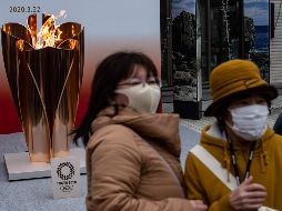 Estiman que hasta 50 mil personas se habrían reunido al rededor del fuego olímpico. AFP / P. Fong