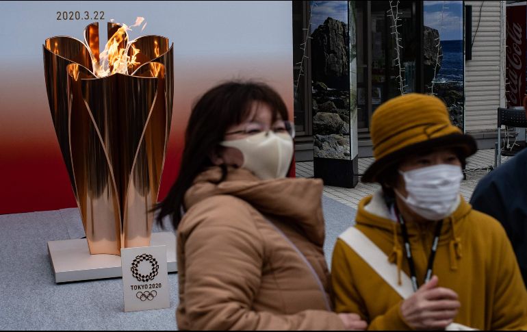 Estiman que hasta 50 mil personas se habrían reunido al rededor del fuego olímpico. AFP / P. Fong