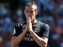 Bale dice que en España ''es bastante estricto, no se puede salir a casi nada, ni hacer deporte, pero lo entendemos, sin sacrificios necesarios''. AFP / ARCHIVO