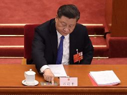 El presidente Xi Jinping emite su voto sobre la ley en el Palacio del Pueblo en Pekín. AFP/N. Asfouri
