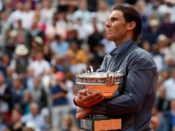 ''Me proyecto en un mundo en el que podamos proteger la salud de toda la gente que trabaja en el torneo'', señaló el 12 veces campeón de la competencia. AP / ARCHIVO