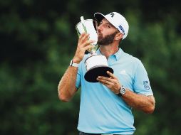 AMARRA. Johnson tuvo que sobreponerse a una suspensión por mal tiempo para quedarse con el título. AFP / M. Meyer