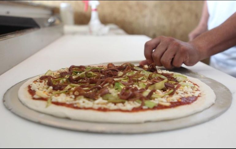 El asaltante huyó a bordo de un automóvil luego de que le arrojaran una pizza. EL INFORMADOR/ARCHIVO