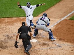 Clint Frazier marca la carrera de la victoria. AFP/S. Stier