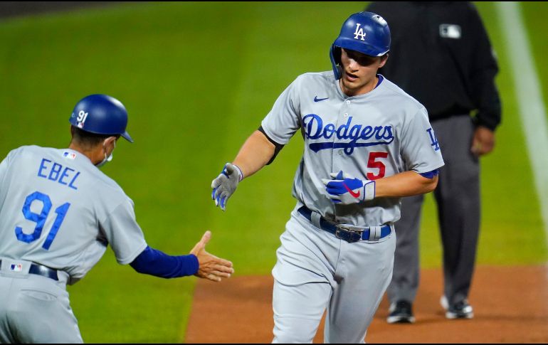 El campocorto Corey Seager consiguió tres imparables, incluido un cuadrangular, en la victoria de los angelinos 9-3 sobre Colorado. AP / D. Zalubowski