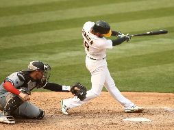 Batazo decisivo. Chad Pinder pegó un leñazo productor de las carreras de la victoria de Oakland sobre Chicago. AFP/E. Shaw