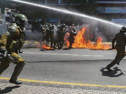 PROTESTA. Los antimotines dispersaron una manifestación realizada en el marco de la conmemoración del descubrimiento de América. AP