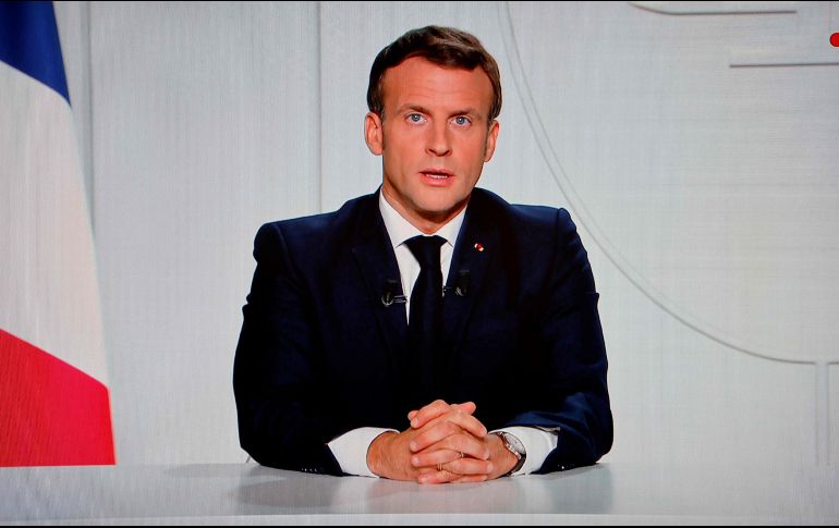 ''Las fábricas, las explotaciones agrícolas y las obras públicas seguirán funcionando. La economía no debe pararse ni hundirse'', afirmó el mandatario. AFP / L. Marin