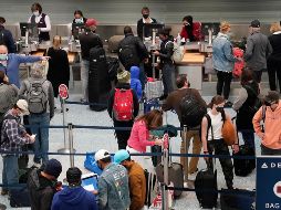 Una fila para registarse en vuelos en Minneapolis, en Minnesota. AP/StarTribune/D. Joles