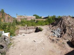 En el lugar se usó maquinaria para remover la tierra del predio hasta descartar la presencia de más restos humanos y óseos. FACEBOOK / Fiscalía del Estado de Jalisco