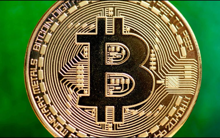 El bitcoin alcanzó un máximo histórico en 20 mil 787.35 dólares, según datos de la agencia Bloomberg. AFP/ARCHIVO