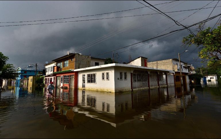 López Obrador culpó del desastre en Tabasco a gobiernos anteriores que no desazolvaron los cauces que corren en esa Entidad. EL INFORMADOR/ARCHIVO