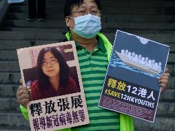 Activistas piden la liberación de Zhang Zhan detenida por autoridades chinas. AP/ K. Cheung
