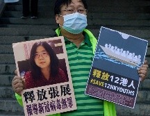 Activistas piden la liberación de Zhang Zhan detenida por autoridades chinas. AP/ K. Cheung