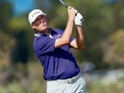 ALCANZA. Ryan Palmer tuvo un recorrido de 64 golpes para igualar a Harris English en el liderato. AFP• G. Shamus