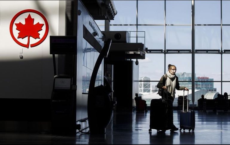 Air Canada enfrenta una brutal caída del flujo de pasajeros calculada en 88% en el tercer trimestre de 2020. AFP/C. Burston