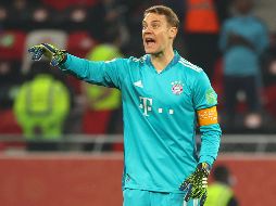 ''Me parece haber visto un lindo Tigre'', escribió el Bayern en sus redes sociales junto a un par de fotos de Manuel Neuer ''buscando'' en el campo al felino. AFP / K. Jaafar