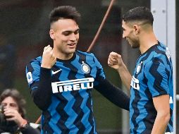 DOBLETE. Lautaro Martínez (izquierda) salió en un gran día frente a los archirrivales del Milan. AFP