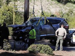 Detallan que Woods conducía a gran velocidad y perdió el control de su vehículo antes de dar varias vueltas de campana al salirse de la carretera. EFE/E. Laurent
