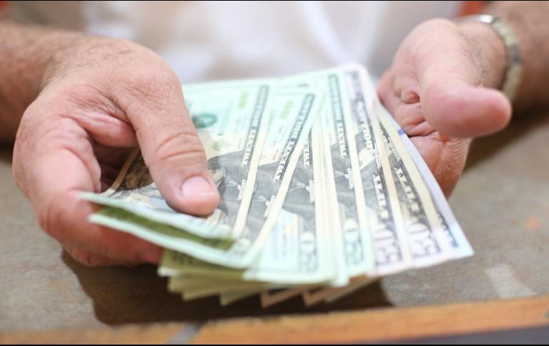 En las últimas cinco sesiones, el tipo de cambio tocó un mínimo de 20.35 pesos por dólar y un máximo de 21.048. EL INFORMADOR/ARCHIVO