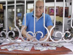 La reforma eléctrica y tensiones en Estados Unidos influyen al comportamiento de la moneda mexicana frente al dólar. EL INFORMADOR / ARCHIVO