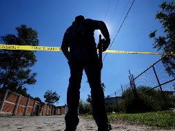 La dependencia continúa con el procesamiento de la escena para la localización de más indicios. AFP  / ARCHIVO