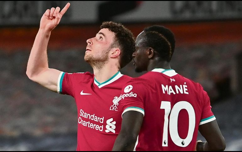 APENITAS. Diogo Jota (izq.) marcó en tiempo de reposición de la primera mitad. AP • P. Ellis