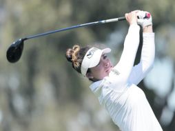 EN LA PELEA. La golfista capitalina buscará un buen cierre para terminar en el Top-10. AFP