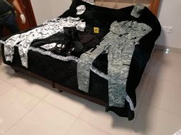 Autoridades realizaron las labores de registro en una casa de la calle Del Archiduque. ESPECIAL/Fiscalía de Jalisco