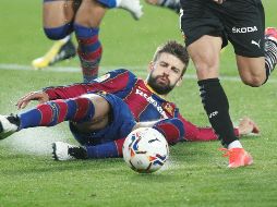 Piqué, el central del Barcelona, aseguró tras la victoria en Mestalla, no dejarán de pelear hasta conseguir el campeonato. EFE / K. Försterling