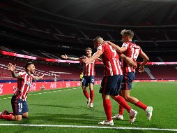 Si el Real Madrid no gana al Granada el jueves, una victoria de los de Simeone el próximo domingo contra el Osasuna daría el título liguero a los rojiblancos. AFP / P. Philippe Marcou