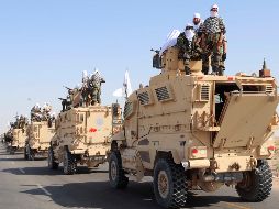 Los combatientes iban sentados al mando de los camiones que durante las dos décadas de conflicto utilizaron las fuerzas estadounidenses. EFE