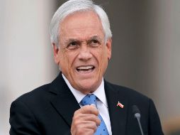 En una rueda de prensa en Santiago, Sebastián Piñera dijo que se desligó de la administración de sus empresas e intereses financieros en abril de 2019. AFP/J. Torres
