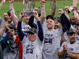 Campeón. Roberto Magallanes (esquina inferior izquierda) celebrando la obtención de la Serie Mundial con los Braves de Atlanta. AP