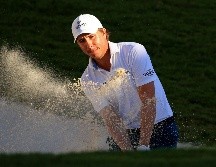 El golfista Carlos Ortiz se adjudicó el segundo lugar del Torneo Mayakoba hoy, en Playa del Carmen, Quintana Roo. AFP/M. Ehrmann