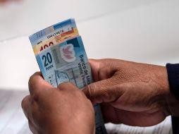 La ley en México establece sanciones por no pagar el aguinaldo en tiempo y forma. AFP/ARCHIVO