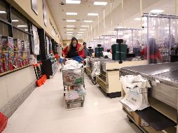 La fácil transmisibilidad de la variante ómicron está afectando a empresas, oficinas gubernamentales y servicios públicos por igual. AFP/M. Loccisano