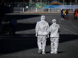Las cifras difundidas mostraron 11 pruebas positivas entre 379 deportistas y funcionarios que llegaron el lunes. AFP / W. Zhao