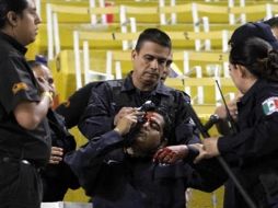 En el partido de Atlas vs Monterrey en el Torneo Apertura 2014 hubo agresiones a policías que resultaron lesionados. ESPECIAL