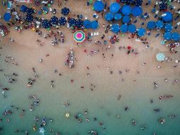 La Cofepris señaló que 289 de 290 playas son aptas como escenario turístico para estas vacaciones. SUN/ARCHIVO