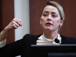 Amber Heard declaró algo muy fuerte este día, pues mencionó que su expareja la agredió sexualmente con una botella de licor durante un ataque de ira que fue ocasionado por el alcohol. AFP / J. Lo