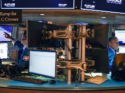 Por sectores, predominaron las ganancias, que estuvieron encabezadas por las empresas sanitarias, de bienes raíces y energía. AP/S. Wenig