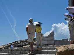 Los turistas que se encontraban en la playa de Pingtan, una isla china situada cerca de la zona de las maniobras, fueron testigos de los disparos. AFP / H. Retamal