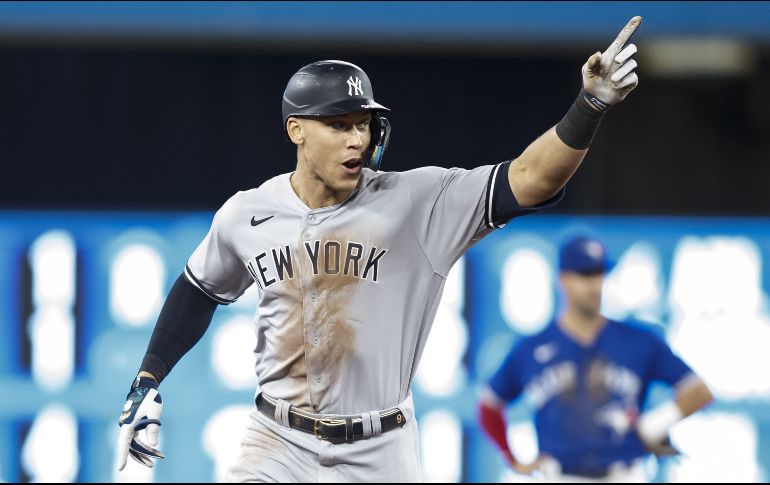 Judge recorrió las bases sonriendo, cobijado por los aplausos de los presentes y con sus padres, que lo adoptaron de pequeño, en las gradas. AFP/C. Burston