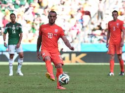 El exfutbolista Wesley Sneijder, jugando contra México en el Mundial de Brasil 2014. AFP / ARCHIVO