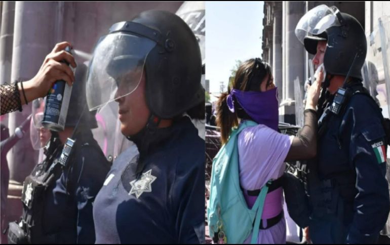 Si bien cayeron latas de aerosol, latas de refresco, agua, pintura blanca, roja, y carteles sobre las policías, estas se mantuvieron firmes, sin responder a los cuestionamientos de las mujeres. SUN / C. González