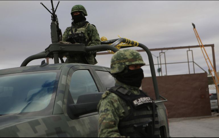 Elementos de seguridad resguardan una casa en la colonia El Mante. ARCHIVO